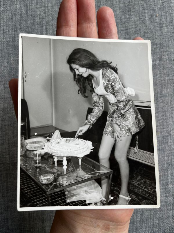 This picture showed a photo of a woman cutting her birthday cake in Iran 1973 5 years before the Islamic Revolution, according to Reddit and Twitter, but in reality was taken in 1971 and the cake was for a colleague's birthday.